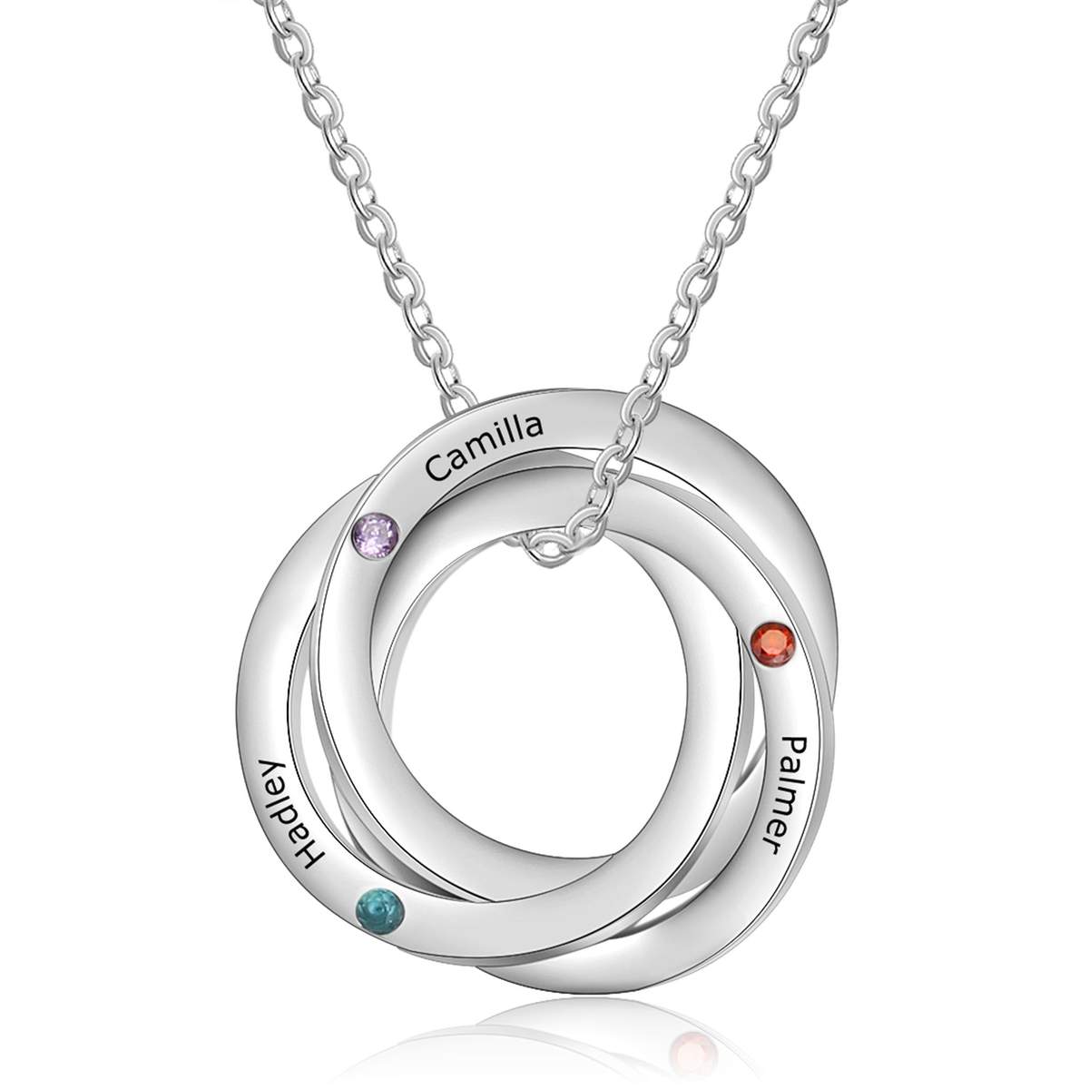 A Russian ring necklace with three interlocking rings set with birthstones — past, present and future
